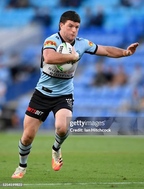 Chad Townsend of the Sharks runs the ball during the round eight NRL match between the Gold Coast Titans and the Cronulla Sharks at Cbus Super...