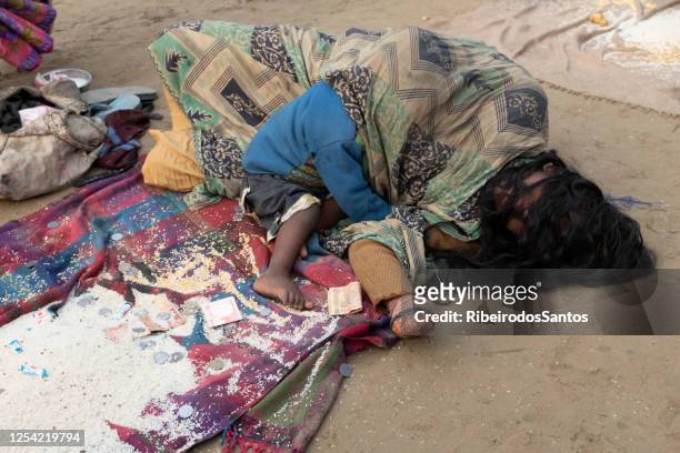 leper woman and child - leprosy stock pictures, royalty-free photos & images