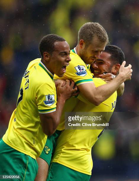 Bradley Johnson of Norwich City is congratulated by team mates after scoring the second goal during the Barclays Premier League match between Bolton...