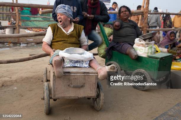 amputee lepers begging in kumbh mela - leprosy stock pictures, royalty-free photos & images