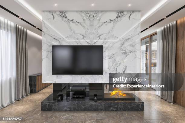 tv wall with fireplace - home theatre stock pictures, royalty-free photos & images