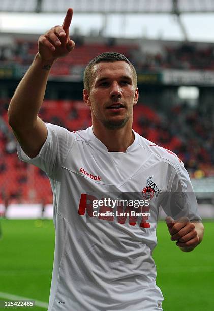 Lukas Podolski of Koeln celebrates after winning the Bundesliga match between Bayer 04 Leverkusen and 1. FC Koeln at BayArena on September 17, 2011...