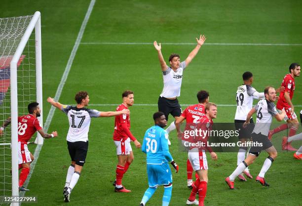 Chris Martin of Derby County claims to the referee after he scores his sides first goal during the Sky Bet Championship match between Derby County...