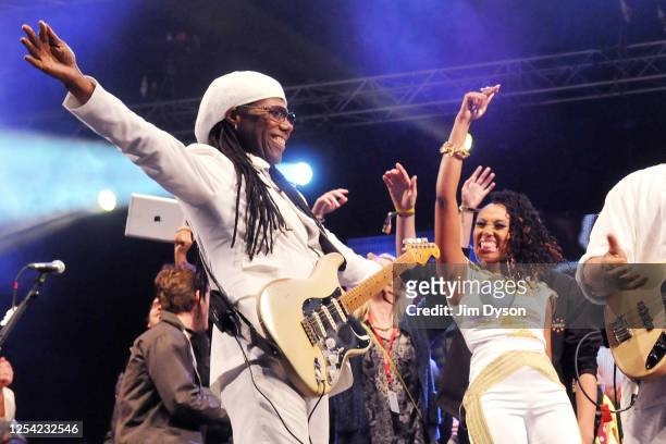 Nile Rodgers and Folami Ankoanda-Thompson of Chic perform on the West Holts stage during day 2 of the 2013 Glastonbury Festival at Worthy Farm on...