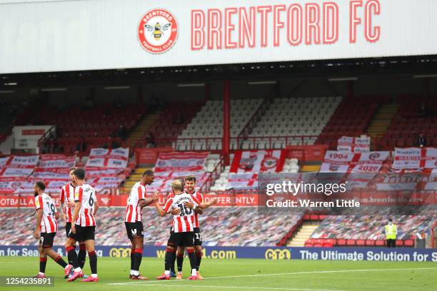 Saïd Benrahma of Brentford FC is congratulated by team mates after scoring the first goal during the Sky Bet Championship match between Brentford and...