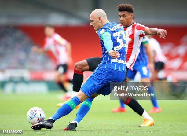 Kal Naismith of Wigan Athletic clears the ball during the Sky Bet Championship match between Brentford and Wigan Athletic at Griffin Park on July 04,...