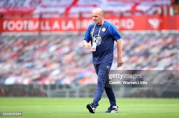 Paul Cook, manager of Wigan Athletic walks to the dug out during the Sky Bet Championship match between Brentford and Wigan Athletic at Griffin Park...