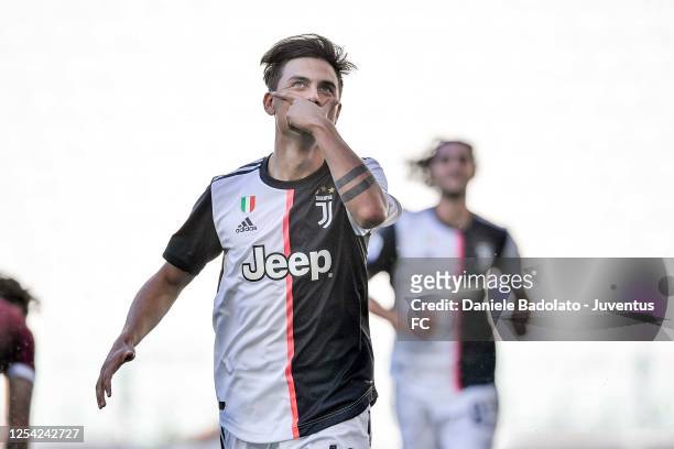 Paulo Dybala of Juventus celebrates after scoring his team's first goal during the Serie A match between Juventus and Torino FC at Allianz Stadium on...