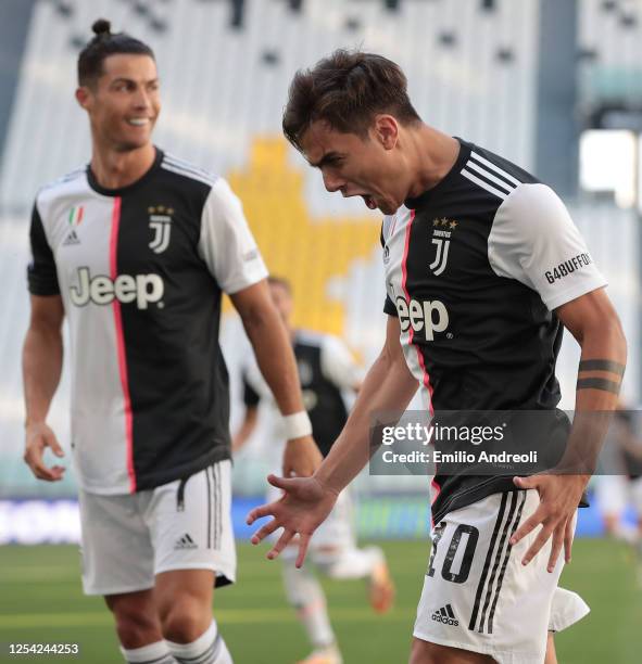 Paulo Dybala of Juventus celebrates after scoring the opening goal during the Serie A match between Juventus and Torino FC at Allianz Stadium on July...