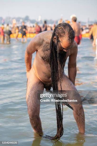 sadhu pulling his genitalia with tongs - testis stock pictures, royalty-free photos & images