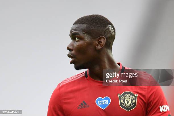 Paul Pogba of Manchester United looks on during the Premier League match between Manchester United and AFC Bournemouth at Old Trafford on July 04,...
