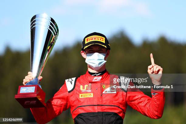 Race winner Callum Ilott of Great Britain and UNI-Virtuosi Racing celebrates on the podium during the feature race for the Formula 2 Championship at...
