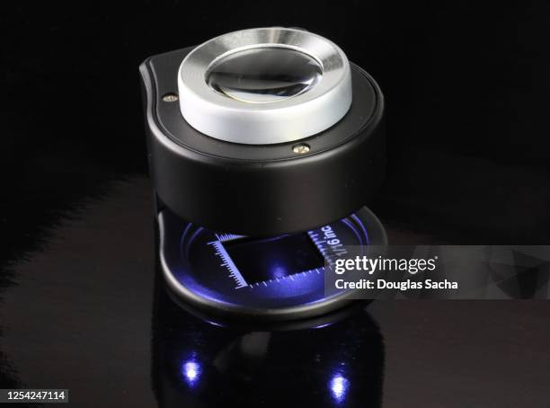 magnification loupe on a black background - jeweller tools stock pictures, royalty-free photos & images