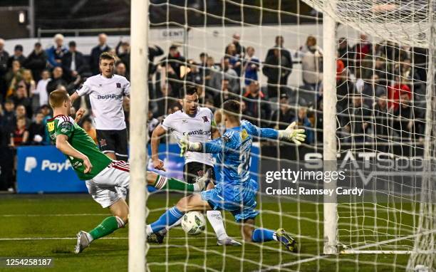 Louth , Ireland - 12 May 2023; Patrick Hoban of Dundalk shoots to score his side's second goal past Cork City goalkeeper Jimmy Corcoran during the...