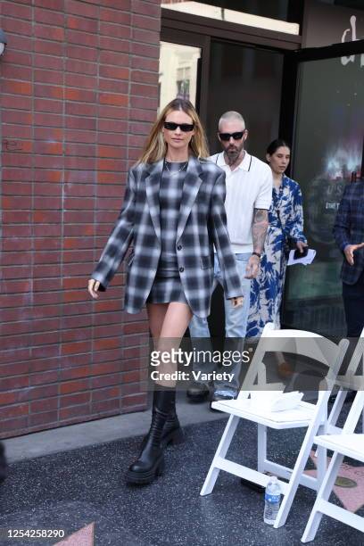 Behati Prinsloo and Adam Levine at the ceremony where Blake Shelton is honored with a star on the Hollywood Walk of Fame on May 12, 2023 in Los...