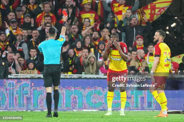 Red card for Kevin Danso of RC Lens during the Ligue 1 match between RC Lens and Stade Reims at Stade Bollaert-Delelis on May 12, 2023 in Lens,...