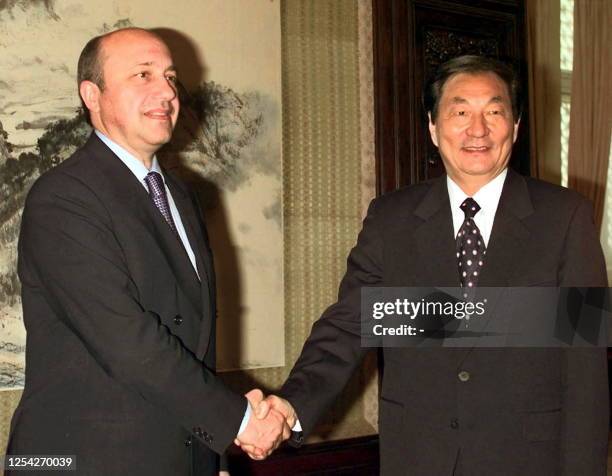 Russian Foreign Minister Igor Ivanov shakes hands with Chinese Premier Zhu Rongji prior to their talks at Zhongnanhai, the Chinese leadership...