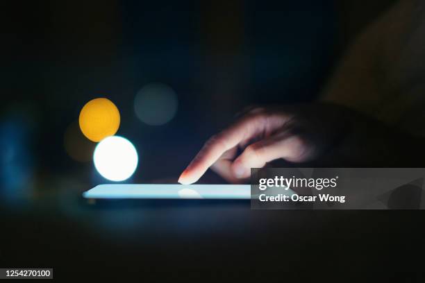 female hands using smart phone in the dark at night - electronic organizer stock pictures, royalty-free photos & images
