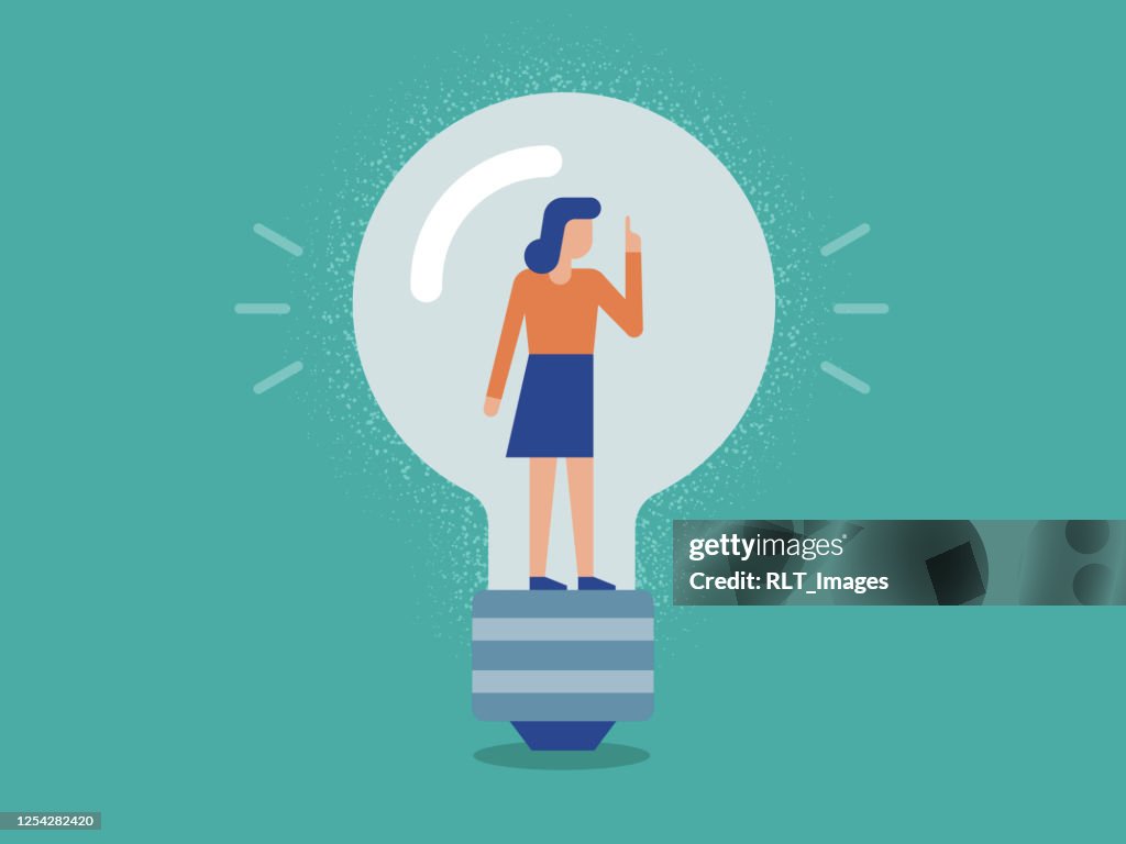 Illustration of Businesswoman inside a Lightbulb