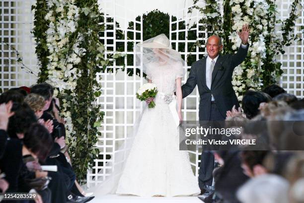 Designer Oscar de la Renta walks the runway during the Pierre Balmain Haute Couture Spring/Summer 2002 fashion show as part of the Paris Haute...