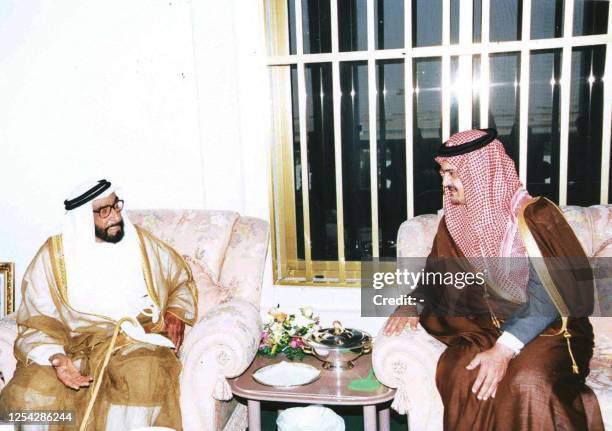 United Arab Emirates President Sheikh Zayed ibn Sultan al-Nahyan speaks with Saudi Foreign Minister Saud al-Faisal 04 March 1999 in Abu Dhabi, where...