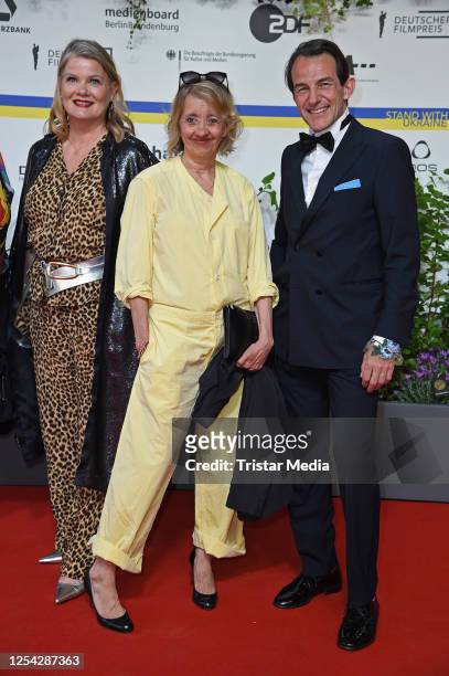 Birge Schade, Anna Boettcher and Hans Werner Meyer attend the Lola - German Film Award 2023 - red carpet arrivals at Theater am Potsdamer Platz on...