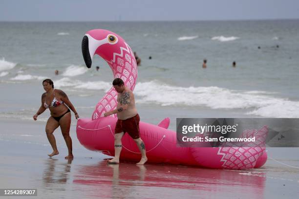 People visit Jacksonville Beach on July 04, 2020 in Jacksonville Beach, Florida. Jacksonville Beach Mayor Charlie Latham said that Duval County...
