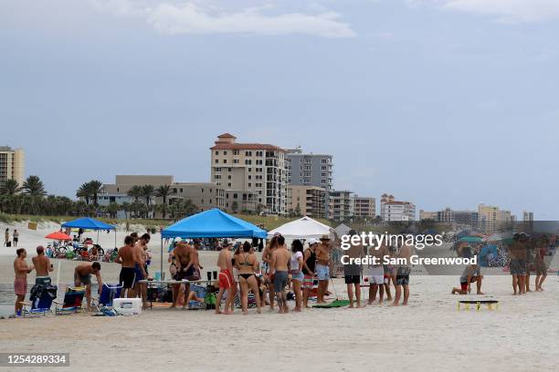 People visit Jacksonville Beach on July 04, 2020 in Jacksonville Beach, Florida. Jacksonville Beach Mayor Charlie Latham said that Duval County...