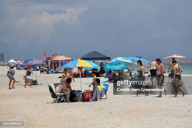 People visit Jacksonville Beach on July 04, 2020 in Jacksonville Beach, Florida. Jacksonville Beach Mayor Charlie Latham said that Duval County...