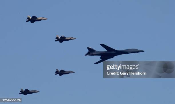 Bomber leads a group of fighter jets during a military flyover as part of Independence Day festivities on July 4, 2020 as seen from Bayonne, New...