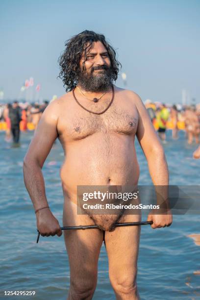 chubby sadhu twisting his genitalia with tongs - birthday suit stock pictures, royalty-free photos & images