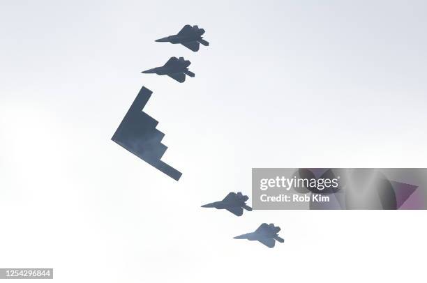 Stealth Bomber flies with F-35 fighter jets over the Hudson River during a military flyover as part of July 4th celebrations on July 04, 2020 in New...