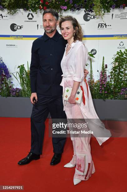 Benjamin Sadler and Karin Hanczewski attend the Lola - German Film Award 2023 - red carpet arrivals at Theater am Potsdamer Platz on May 12, 2023 in...