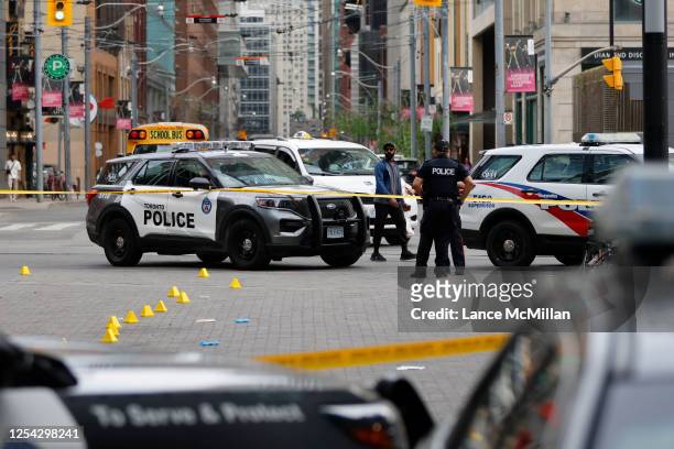 May 12 - Police are pictured at the scene of a fatal stabbing at Victoria St. And Dundas St. E. In Toronto. Lance McMillan/Toronto StarMay-12-2023