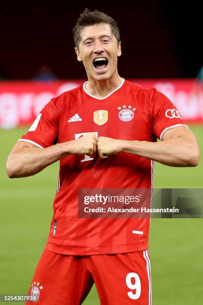 Robert Lewandowski of Bayern Muenchen celebrates scoring the 4th team goal during the DFB Cup final match between Bayer 04 Leverkusen and FC Bayern...