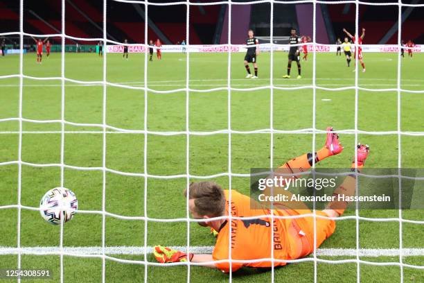 Lukas Hradecky of Leverkusen receives the 3rd goal during the DFB Cup final match between Bayer 04 Leverkusen and FC Bayern Muenchen at...
