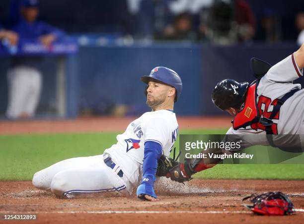 Kevin Kiermaier of the Toronto Blue Jays is tagged out at home plate by Sean Murphy of the Atlanta Braves on a single by George Springer in the fifth...