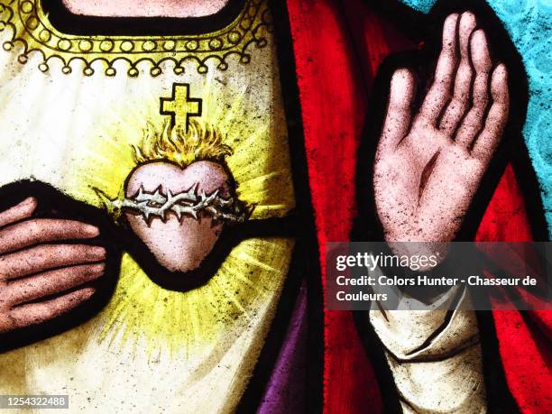 heart and hands of jesus christ on an old stained glass - holy heart fotografías e imágenes de stock