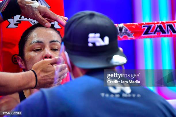 Jackie 'Princesa' Nava receives instructions in her corner during an unofficial fight at TV Azteca as part of Volvemos con Punch TV show on July 4,...