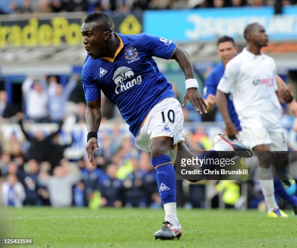 Royston Drenthe of Everton celebrates scoring his team's third goal during the Barclays Premier League match between Everton and Wigan Athletic at...