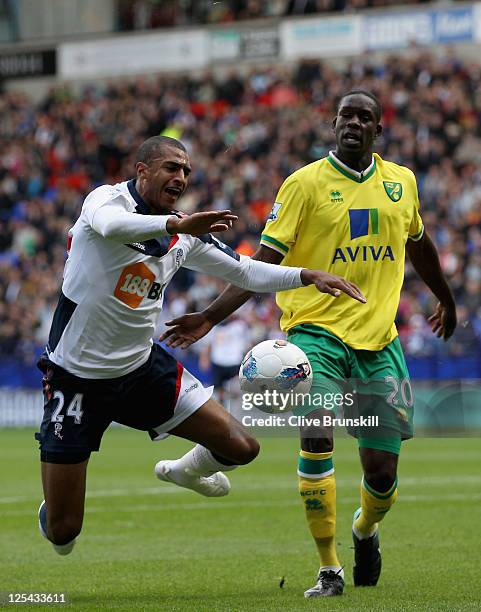 David Ngog of Bolton Wanderers wins a penalty as he is fouled by Leon Barnett of Norwich City during the Barclays Premier League match between Bolton...