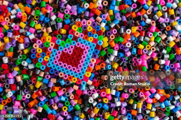 multicolored plastic beads toy for kids. heart - 合成樹脂 ストックフォトと画像