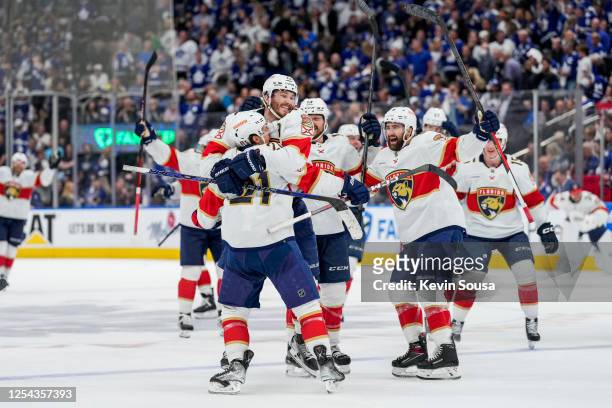 Nick Cousins of the Florida Panthers celebrates his game winning goal against the Toronto Maple Leafs with teammates overtime in Game Five of the...