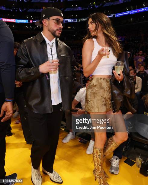 Rapper Bad Bunny and Kendall Jenner attends Game Six of the Western Conference Semi-Finals of the 2023 NBA Playoffs between Golden State Warriors...