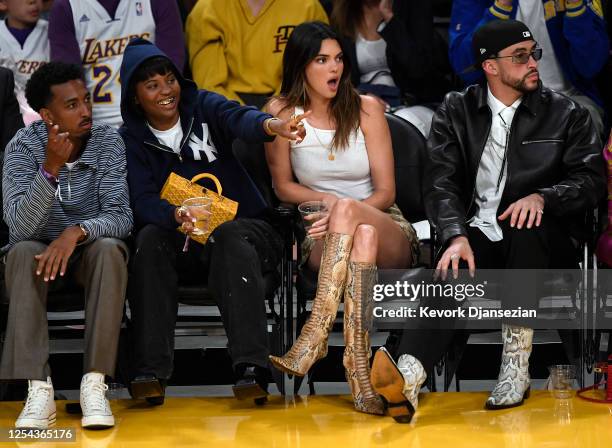 Yung Taco, Renell Medrano, Kendall Jenner and Bad Bunny attend the Western Conference Semifinal Playoff game between the Los Angeles Lakers and...