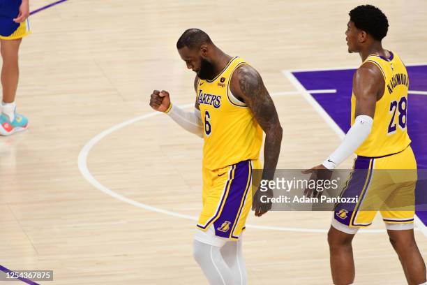 LeBron James of the Los Angeles Lakers celebrates during the game against the Golden State Warriors during the Western Conference Semi-Finals of the...