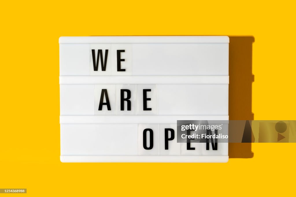 The inscription on the lightbox We are open