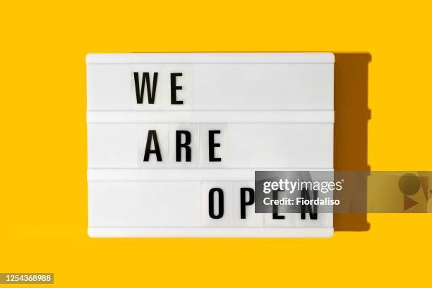 the inscription on the lightbox we are open - open sign stock pictures, royalty-free photos & images