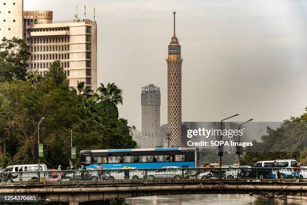 Egyptian commuter bus in traffic on a road bridge over the River Nile in Downtown Cairo, Egypt. Cairo, Egypt's sprawling capital located on the banks...