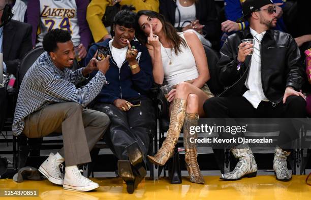 Yung Taco, Renell Medrano, Kendall Jenner and Bad Bunny attend the Western Conference Semifinal Playoff game between the Los Angeles Lakers and...